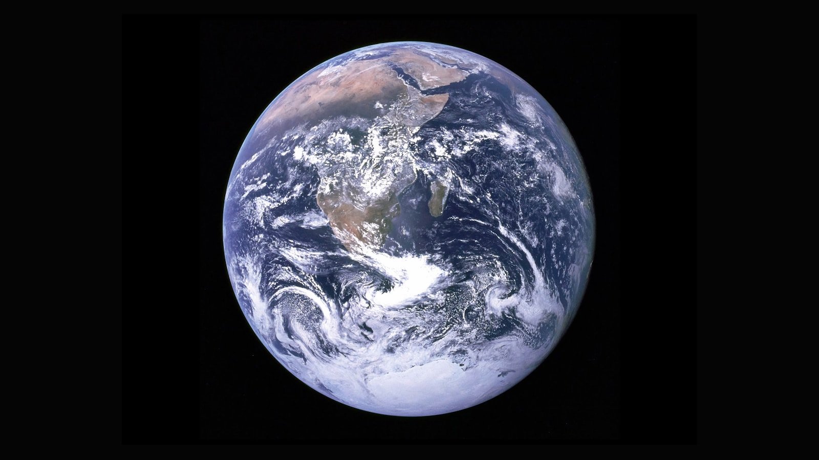 NASA Blue Marble image showing Earth from space with vivid continents and oceans