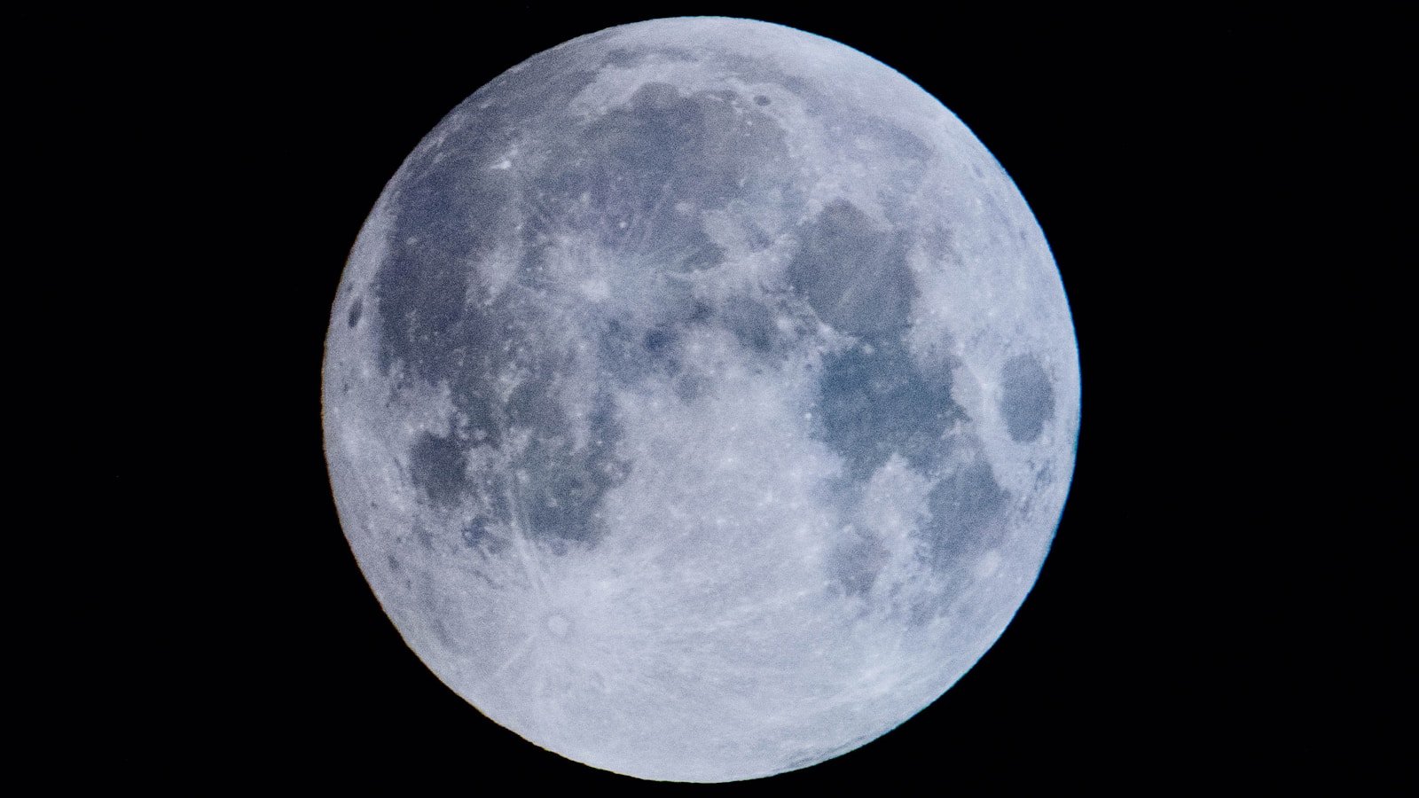 Partial lunar eclipse showing the curved shadow of Earth on the Moon's surface
